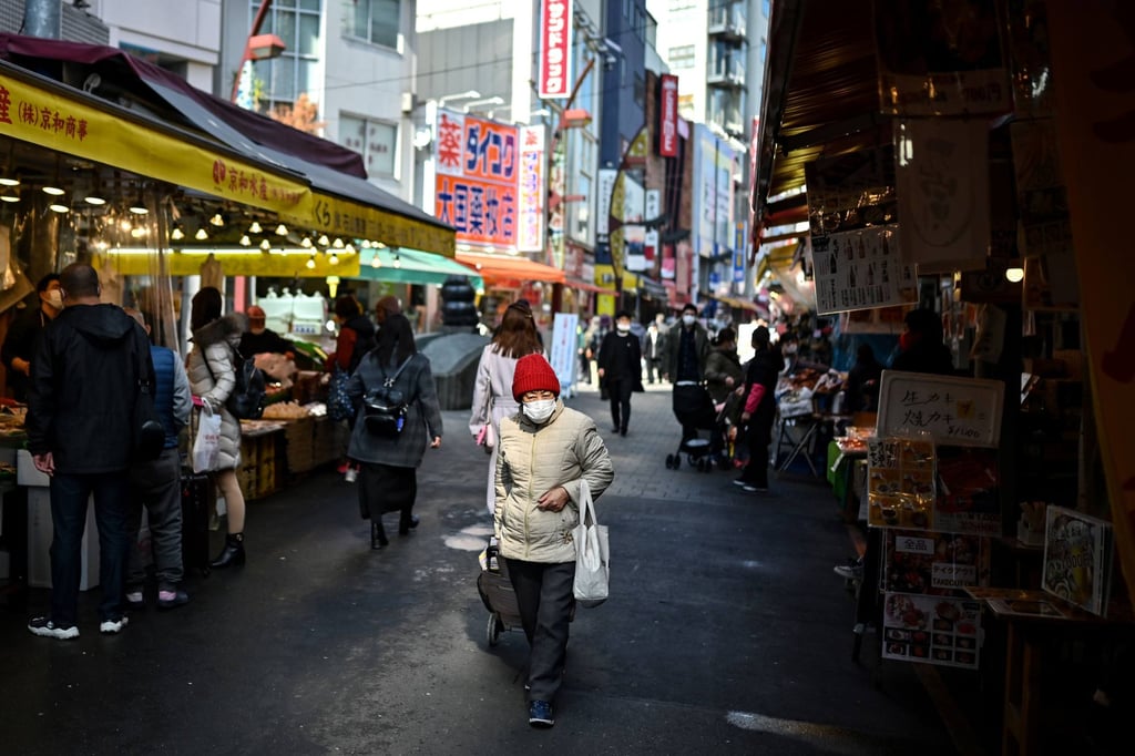An elderly woman walks with her trolley along a street in Tokyo. Japan recorded a record number of elder abuse cases in 2020. Photo AFP