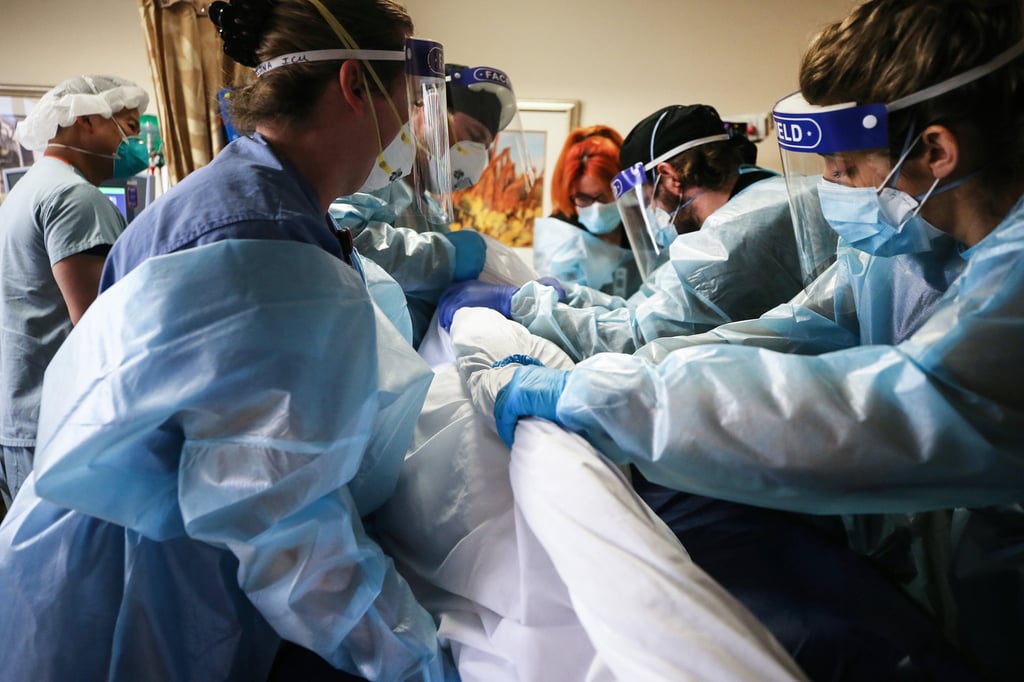 Hospital staff reposition a Covid-19 patient at Providence St. Mary Medical Centre in California on January 6. Photo: TNS Hospital staff reposition a Covid-19 patient at Providence St. Mary Medical Centre in California on January 6. Photo: TNS