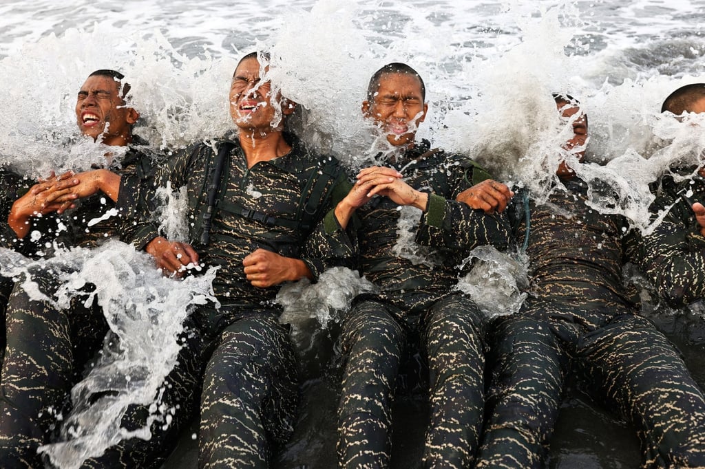 ARP trainees battle the waves while completing training exercises. Photo: Reuters