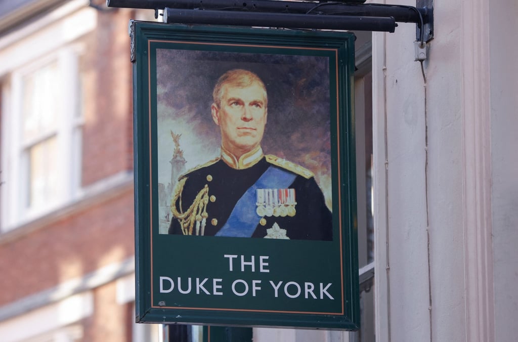 A portrait of Britain’s Prince Andrew is seen on a sign outside the Duke of York public house in London on Friday. Photo: Reuters