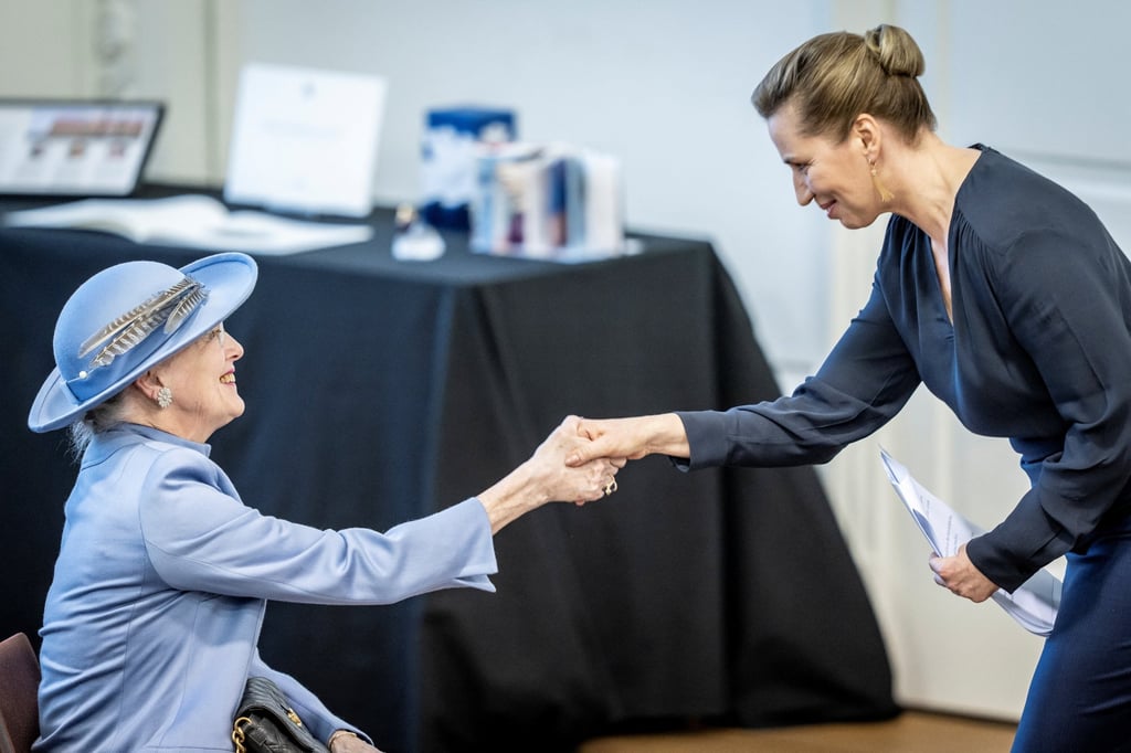 Denmark’s Queen Margrethe (left) is greeted by Prime Minister Mette Frederiksen during parliament’s celebration of her 50th Regent’s Anniversary at Christiansborg Palace in Copenhagen on Friday. Photo: Ritzau Scanpix via Reuters