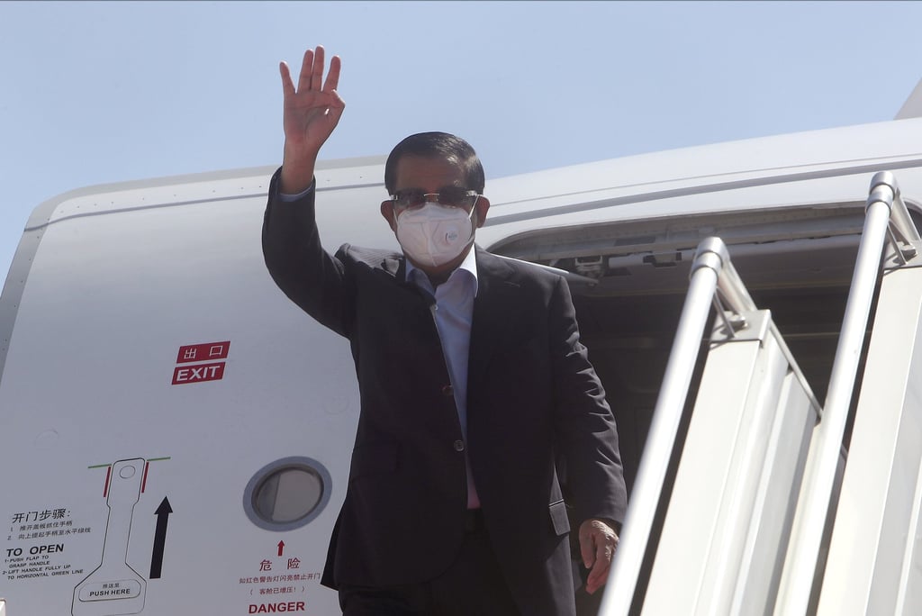 Cambodian Prime Minister Hun Sen waves on January 8 after arriving home from Myanmar. His visit to try to revive peace efforts after last year’s military takeover provoked an angry backlash among critics, who say he is legitimising the army’s seizure of power. Photo: AP