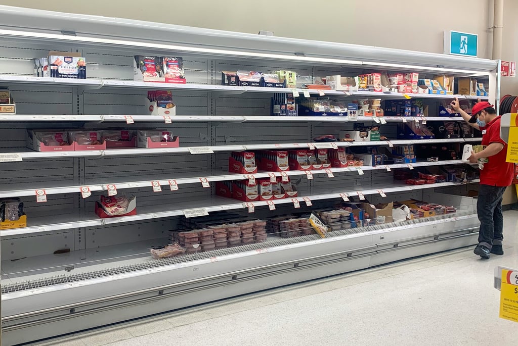 Empty shelves for delicatessen products are seen at a supermarket in Sydney on January 12. The recent spike in Covid-19 infections has caused major logistical disruptions, with staff members, truck drivers and distribution centre workers among those forced to stay at home with the virus or awaiting test results. Photo: AAP/dpa