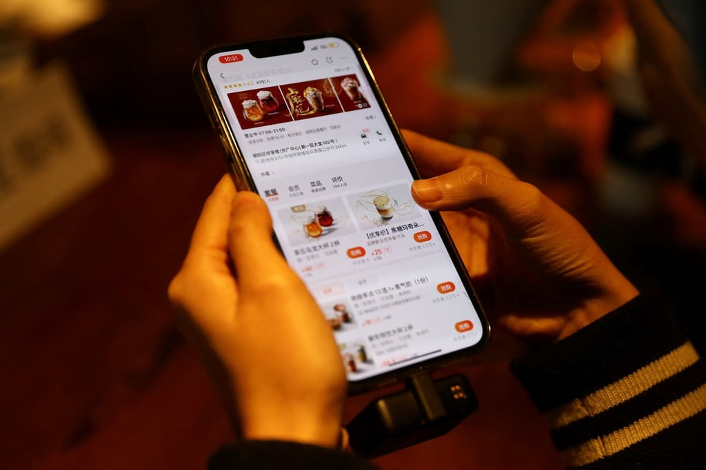 The Starbucks menu is shown on the Meituan app displayed on a smartphone at the US coffee chain’s flagship store in Beijing on January 18, 2022. Photo: Reuters