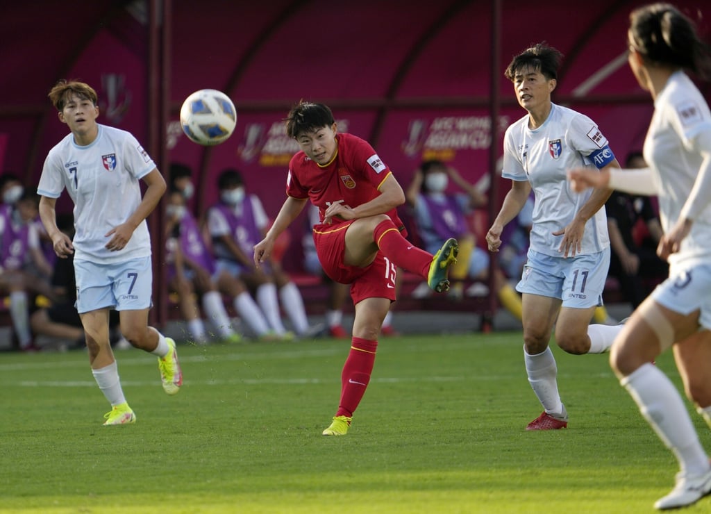 China’s Wu Chengshu kicks the ball against Taiwan. Photo: AP/Rajanish Kakade