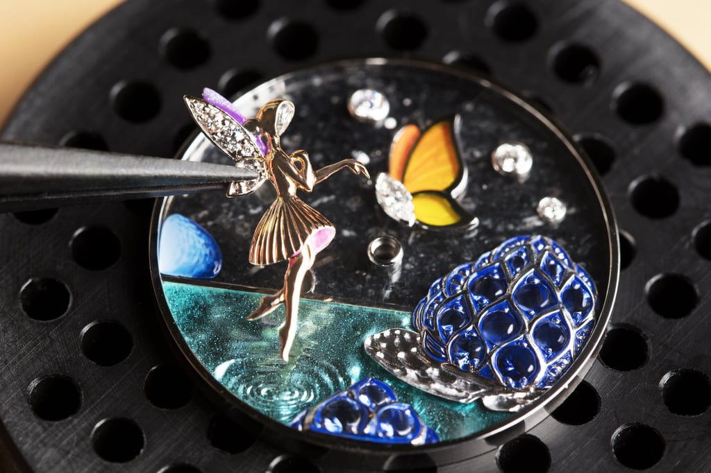The Charms Papillon Féerique watch’s white gold butterfly features a marquise-cut diamond, plique-à-jour enamel, white mother-of-pearl, miniature painting and mother-of-pearl glitters.