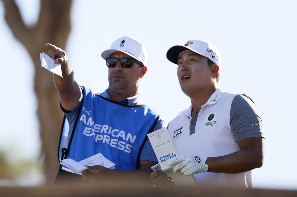 KH Lee of South Korea talks with his caddy on the second hole during the first round of The American Express at the Stadium Course at PGA West. Photo: Getty Images