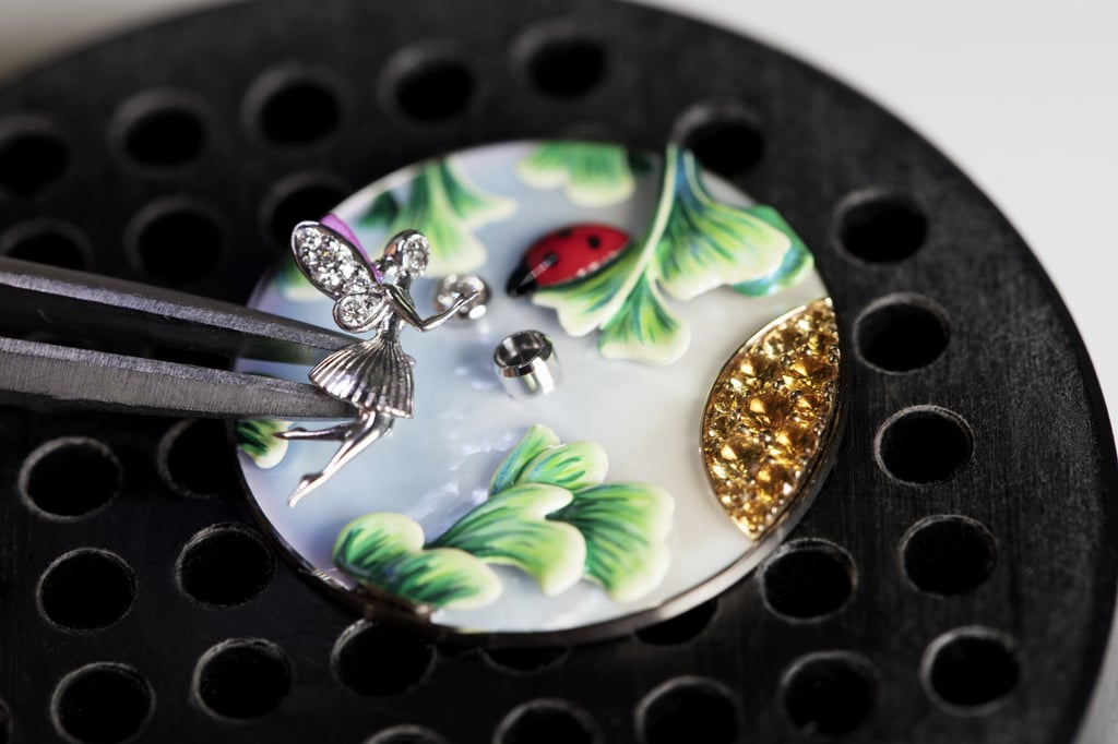 The all-important fairy is added to the tableau on the dial of a Charms Coccinelle Féerique.