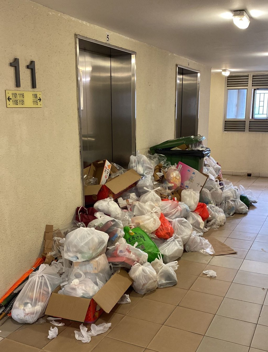 Garbage piles up at in the lift lobby of Yat Kwai House. Photo: SCMP