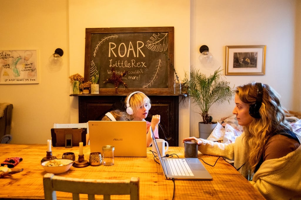 Bethany Stief works from home while twin six-year-old girls Nora and Willa attend online school amid surging Covid-19 cases in Hamilton, Ontario, Canada. Photo: Reuters