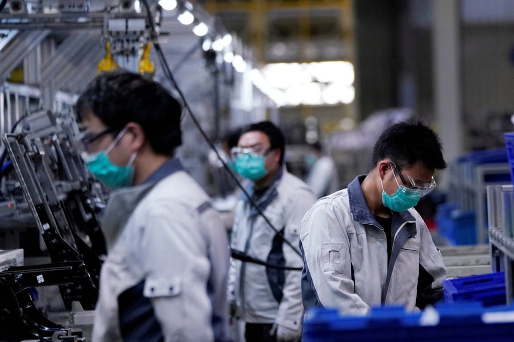 Employees work on a car seat assembly line at Yanfeng Adient factory in Shanghai on February 24 last year. China’s entry into the WTO two decades ago opened the door to global capital drawn to the country’s pool of low-cost labour. Photo: Reuters
