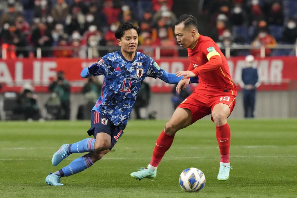 Japan’s Takefusa Kubo (left) challenges Wu Xi for the ball at Saitama Stadium. Photo: AP Japan’s Takefusa Kubo (left) challenges Wu Xi for the ball at Saitama Stadium. Photo: AP
