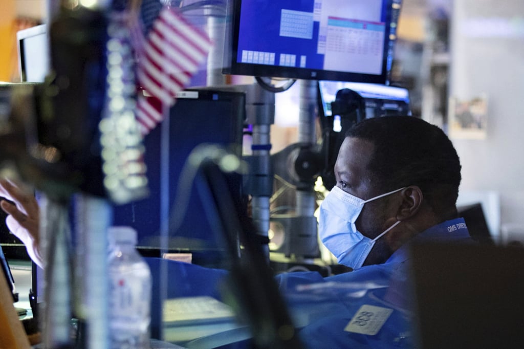 An early market rally on Wall Street gave way to a broad slide for stocks and a surge in bond yields Wednesday after the Federal Reserve signalled plans to begin raising interest rates soon. Photo: AP