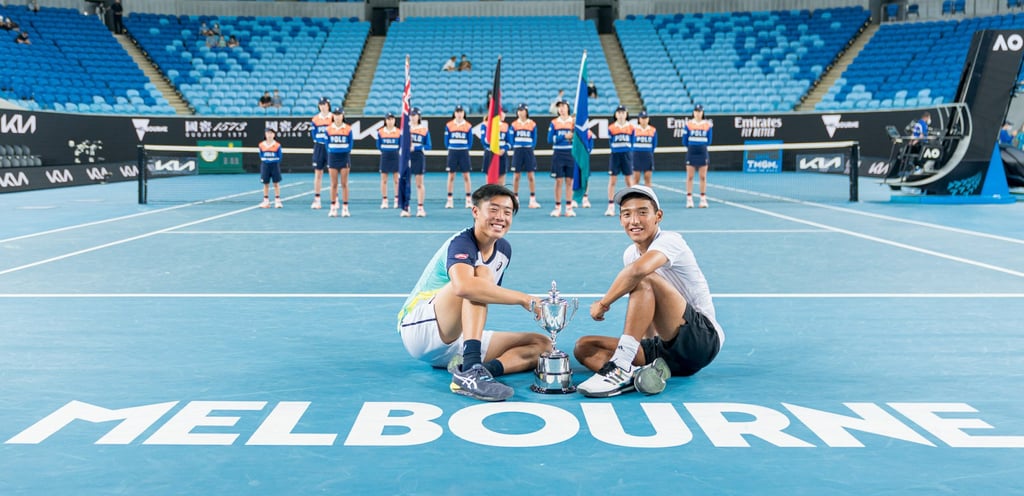 Hong Kong tennis player Coleman Wong (left) with Bruno Kuzuhara after winning the Australian Open Junior Championships boys’ doubles final event in Melbourne. Photo: @arckphoto Hong Kong tennis player Coleman Wong (left) with Bruno Kuzuhara after winning the Australian Open Junior Championships boys’ doubles final event in Melbourne. Photo: @arckphoto