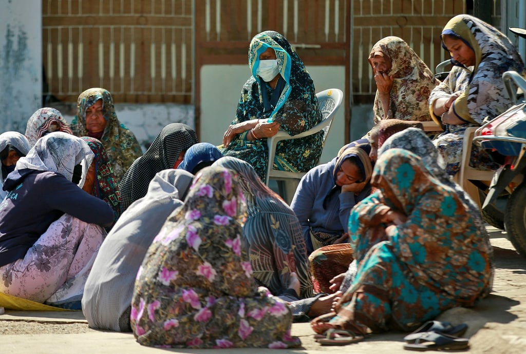 Relatives of Jagdish Patel, who along with his wife and their two children froze to death near the border between the US and Canada last week, gather to mourn the deaths at Patel’s home in Dingucha village in Gujarat, India on Friday. Photo: Reuters Relatives of Jagdish Patel, who along with his wife and their two children froze to death near the border between the US and Canada last week, gather to mourn the deaths at Patel’s home in Dingucha village in Gujarat, India on Friday. Photo: Reuters