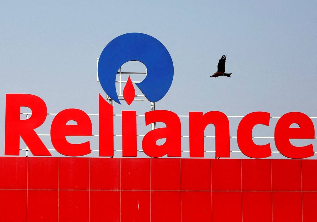A bird flies past a Reliance Industries logo in Ahmedabad, India. Photo: Reuters A bird flies past a Reliance Industries logo in Ahmedabad, India. Photo: Reuters