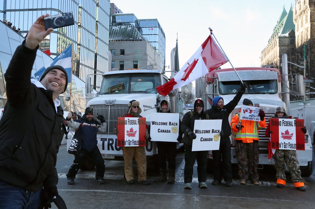 Demonstrators and lorries near Parliament Hill in Ottawa, Ontario, Canada on January 29. Photo: Bloomberg Demonstrators and lorries near Parliament Hill in Ottawa, Ontario, Canada on January 29. Photo: Bloomberg