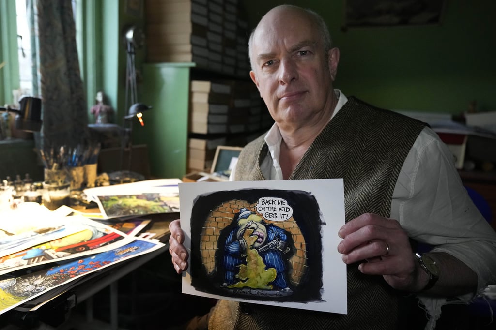 Political cartoonist Martin Rowson with cartoons of Boris Johnson in his studio in London. The bad news besetting Johnson over allegations of lockdown-breaching government parties has been good news for Britain’s humorists, producing an outpouring of satirical responses. Photo: AP
