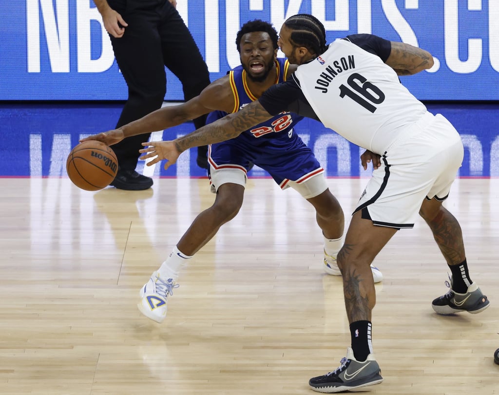Golden State Warriors forward Andrew Wiggins (left) in action against Brooklyn Nets forward James Johnson. Photo: EPA-EFE