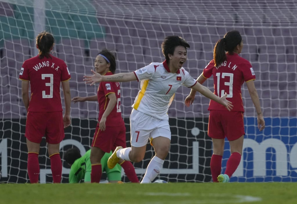 Vietnam’s NTT Dung celebrates giving her side the lead against China in their quarter-final in Navi Mumbai. Photo: AP