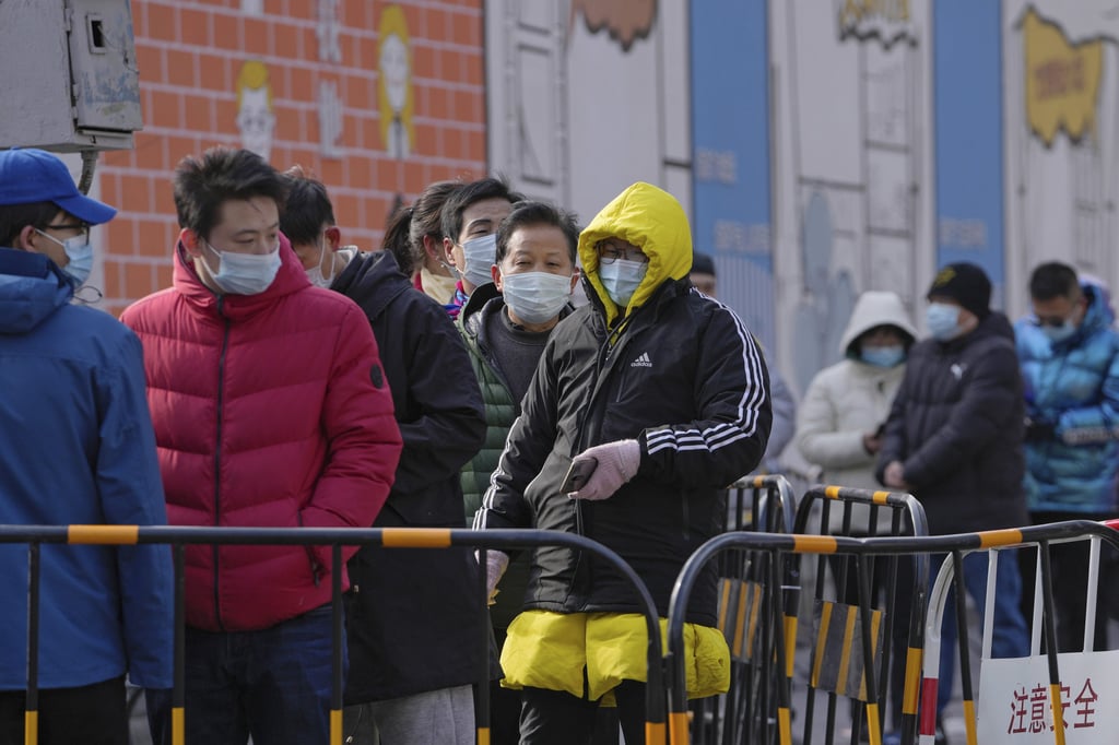 Queue outside a Covid-19 test site on Lunar New Year’s Eve in Beijing. Photo: AP Photo Queue outside a Covid-19 test site on Lunar New Year’s Eve in Beijing. Photo: AP Photo
