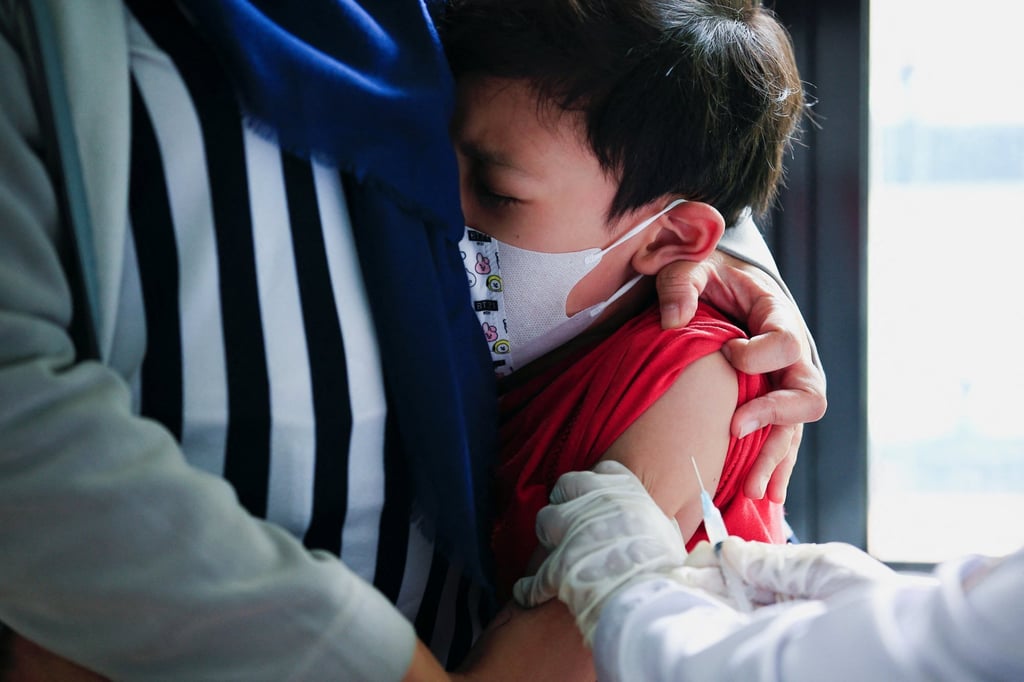 A boy in the Indonesian capital Jakarta receives a vaccine. Photo: Reuters
