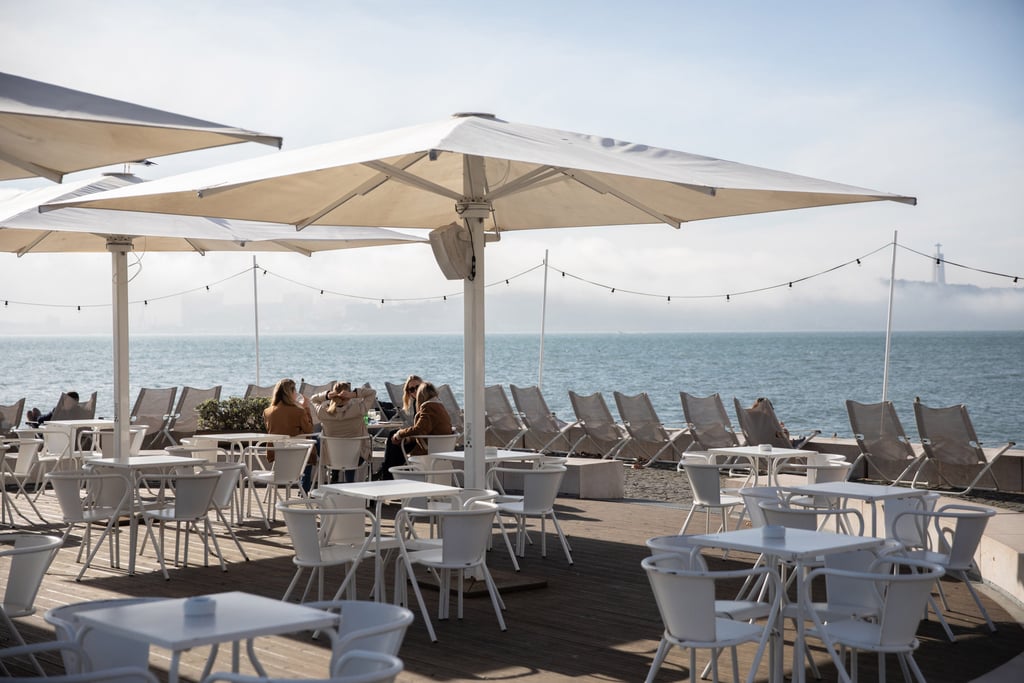 Customers on the terrace of a near-deserted waterside bar in Lisbon earlier this month. Tourism represents about 15 per cent of Portugal’s economy. Photo: Bloomberg Customers on the terrace of a near-deserted waterside bar in Lisbon earlier this month. Tourism represents about 15 per cent of Portugal’s economy. Photo: Bloomberg