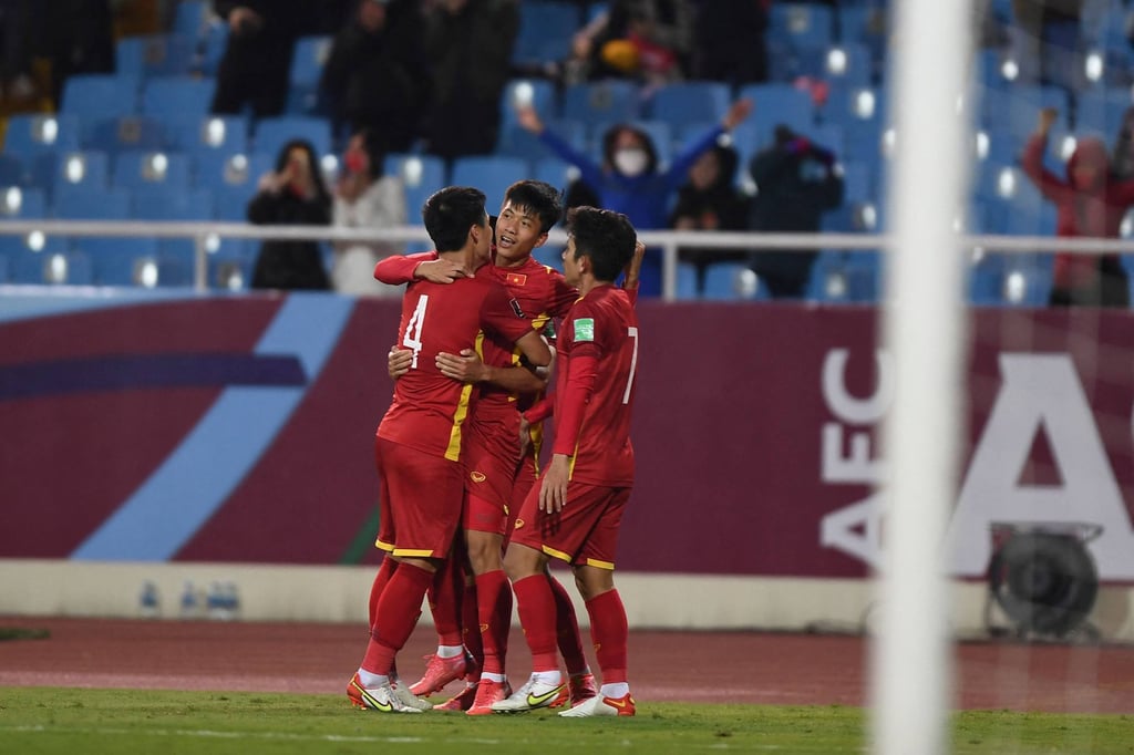 Vietnam’s players celebrate after scoring against China. Photo: Nhac Nguyen/AFP