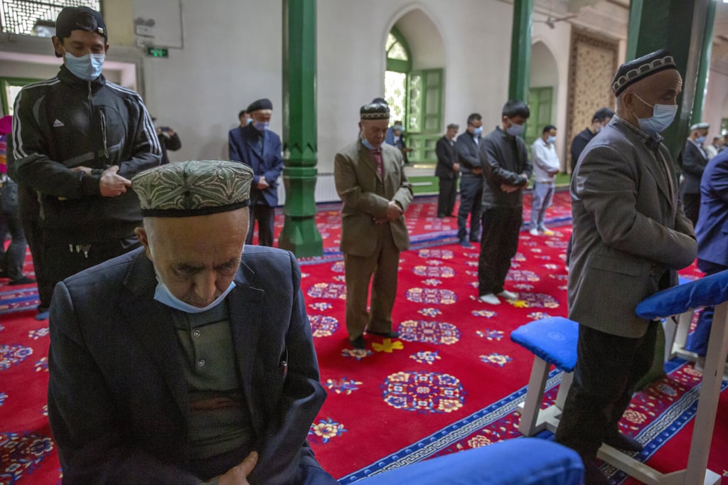 Uygurs and other members of the faithful pray at a mosque in Kashgar, Xinjiang. The Japanese parliamentary resolution expressed concern about human rights in the far western region, as well as in Tibet, Inner Mongolia and Hong Kong. Photo: AP Uygurs and other members of the faithful pray at a mosque in Kashgar, Xinjiang. The Japanese parliamentary resolution expressed concern about human rights in the far western region, as well as in Tibet, Inner Mongolia and Hong Kong. Photo: AP