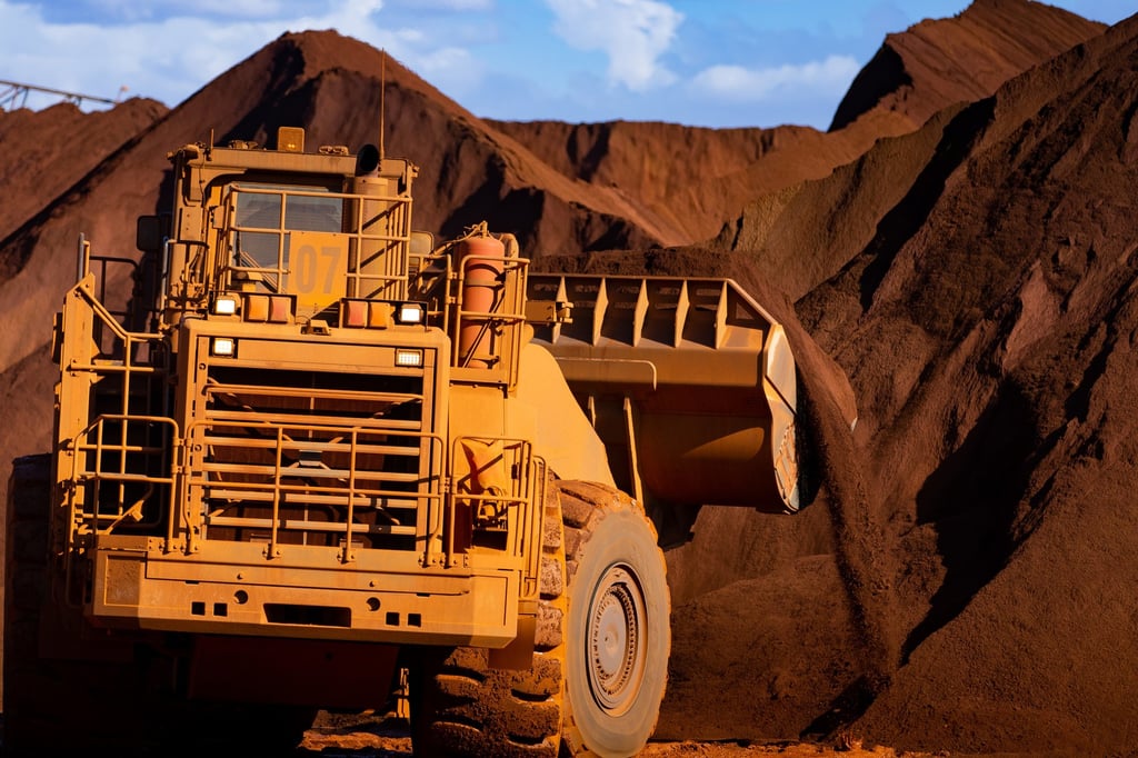 Excavators move iron ore in Port Hedland, Australia. File photo: Bloomberg Excavators move iron ore in Port Hedland, Australia. File photo: Bloomberg