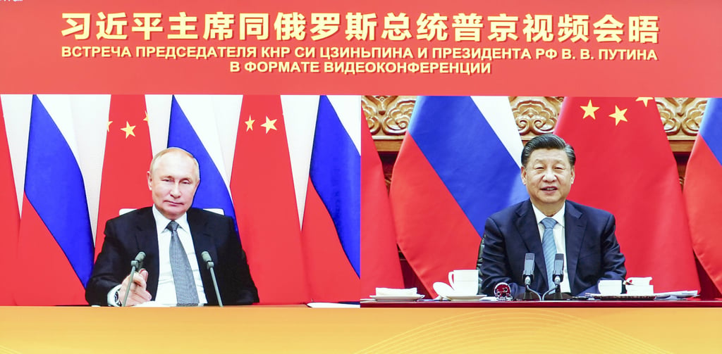 Chinese President Xi Jinping talks to Russian President Vladimir Putin via video link in December. Photo: Xinhua