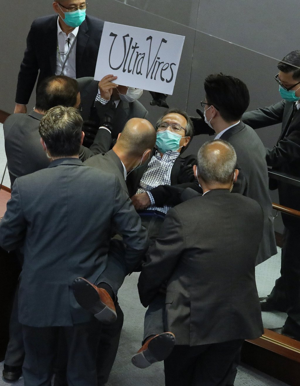 Fernando Cheung is carried out by security staff during the House Committee meeting on May 8, 2020. Photo: Dickson Lee