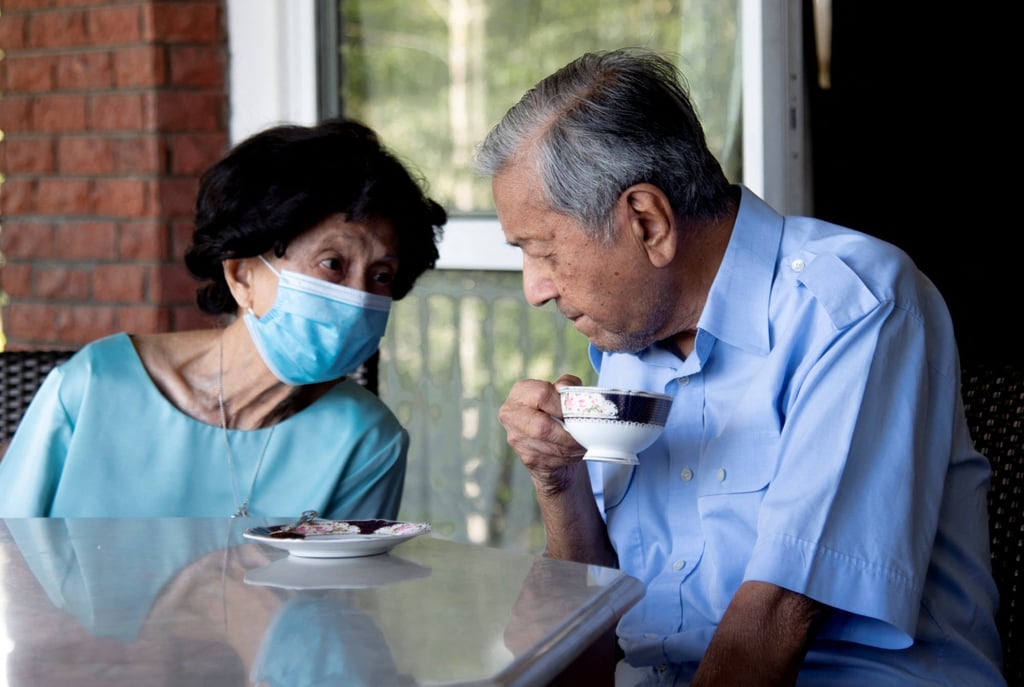 Former Malaysian Prime Minister Mahathir Mohamad and his wife, Siti Hasmah Mohamad Ali, at home. Photo: Reuters