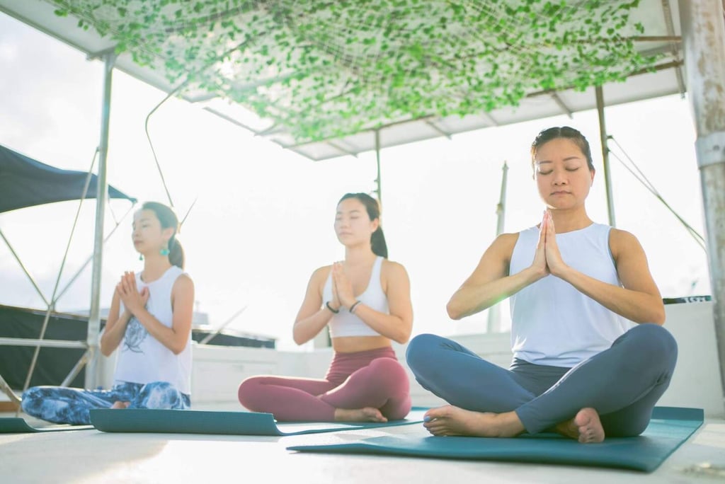 Yoga on a yacht, one of Hong Kong’s unexpected staycation options. Photo: Handout Yoga on a yacht, one of Hong Kong’s unexpected staycation options. Photo: Handout