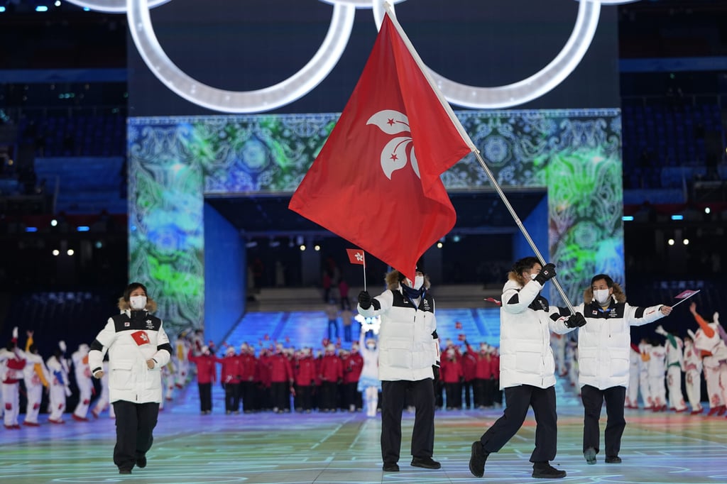 Hong Kong flag bearer Sidney Chu enters the National Stadium during the opening ceremony. Photo: AP