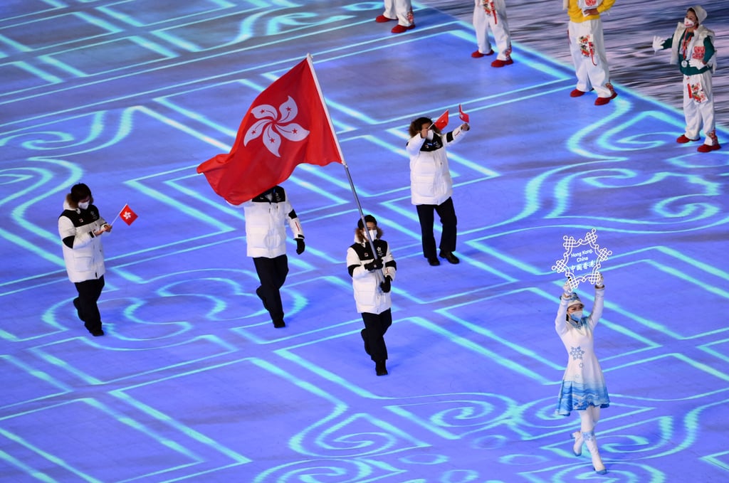 Flag bearer Sidney Chu carries the Hong Kong flag during the athletes’ parade at the opening ceremony. Photo: Reuters/Annegret Hilse