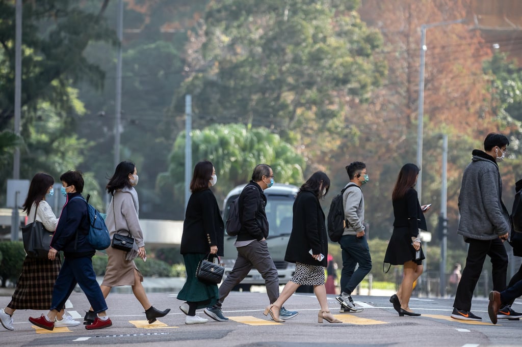 Commuters in Hong Kong’s Central district on January 27. The Hong Kong government is working with local financial regulators and the mainland Chinese authorities to assess the feasibility and policy support required for developing the city as a carbon trading centre for the Greater Bay Area and Asia as a whole. Photo: Bloomberg Commuters in Hong Kong’s Central district on January 27. The Hong Kong government is working with local financial regulators and the mainland Chinese authorities to assess the feasibility and policy support required for developing the city as a carbon trading centre for the Greater Bay Area and Asia as a whole. Photo: Bloomberg