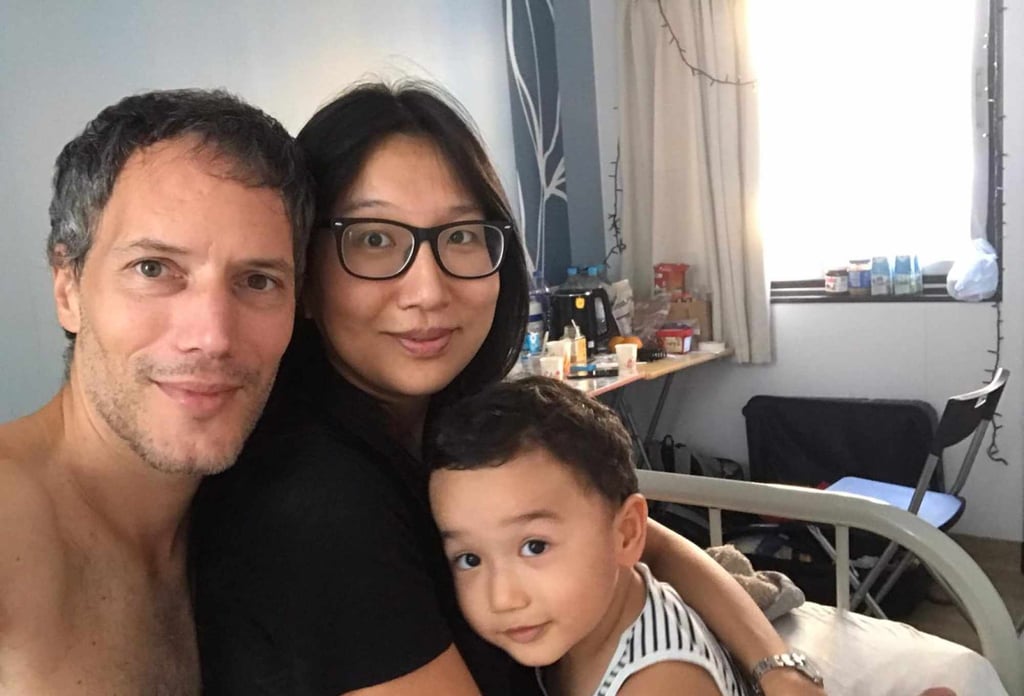 Oliver Nowak with his wife Wai Lau and son Leo inside their room at Penny’s Bay in October 2020. Photo: Olivier Nowak