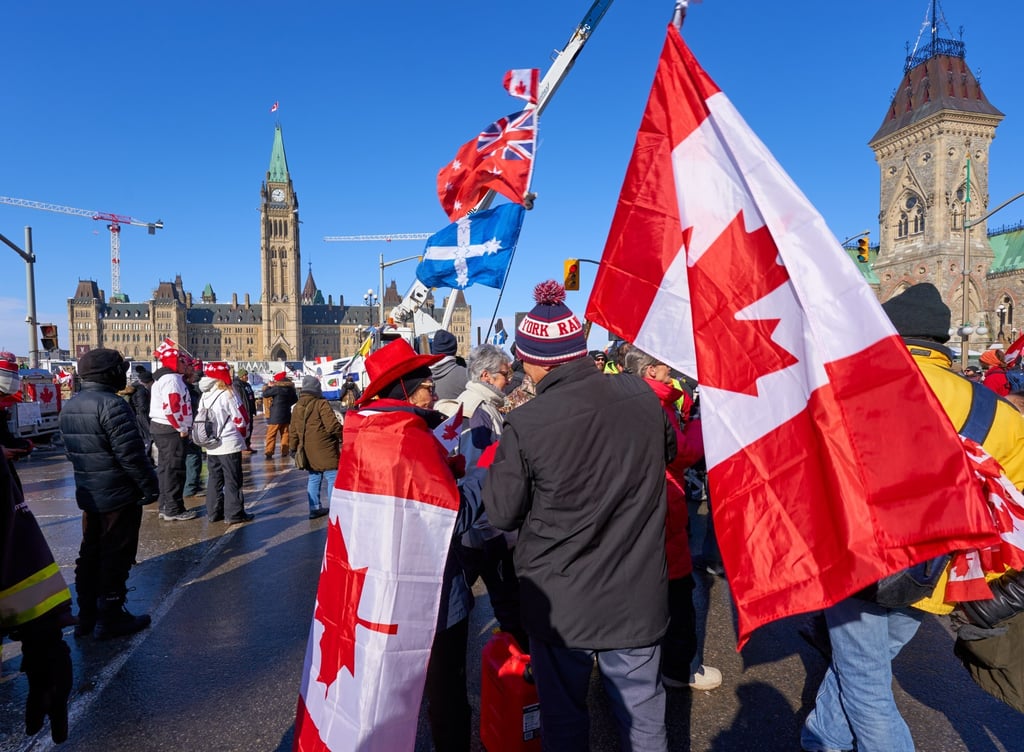 People attend a rally and a sit-in at the Canadian capital on Monday, as a protest by truck drivers over Covid-19 restrictions continues. Photo: EPA-EFE