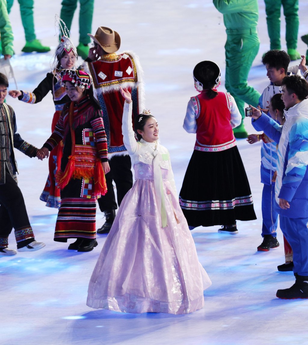 A performer in a traditional Korean dress known as hanbok waves during the Opening Ceremony of the Beijing 2022 Olympic Games. Photo: EPA