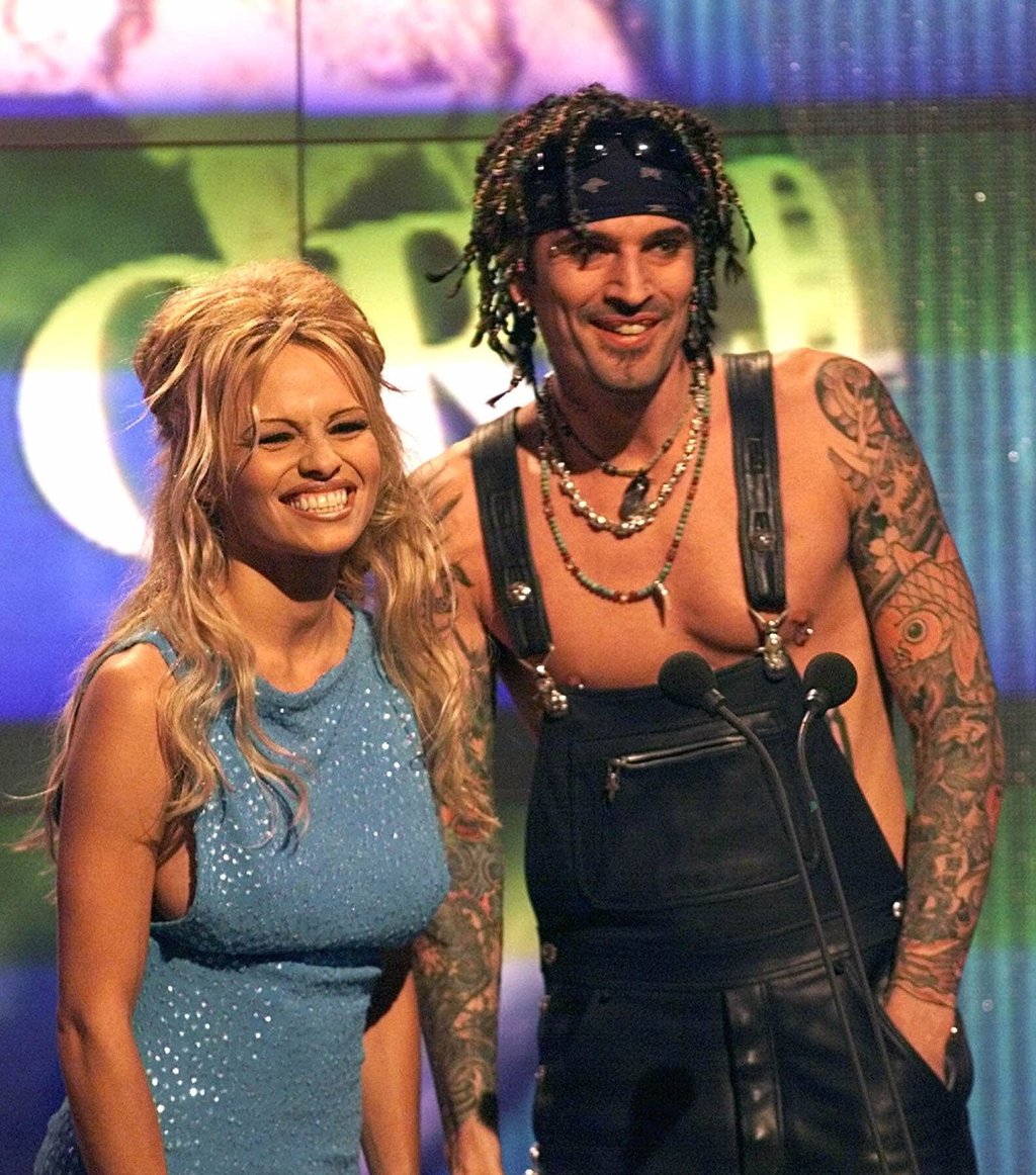 Pamela Anderson Lee presents a music award with her then-husband Tommy Lee during the 1999 World Music Awards. Photo: AP Pamela Anderson Lee presents a music award with her then-husband Tommy Lee during the 1999 World Music Awards. Photo: AP