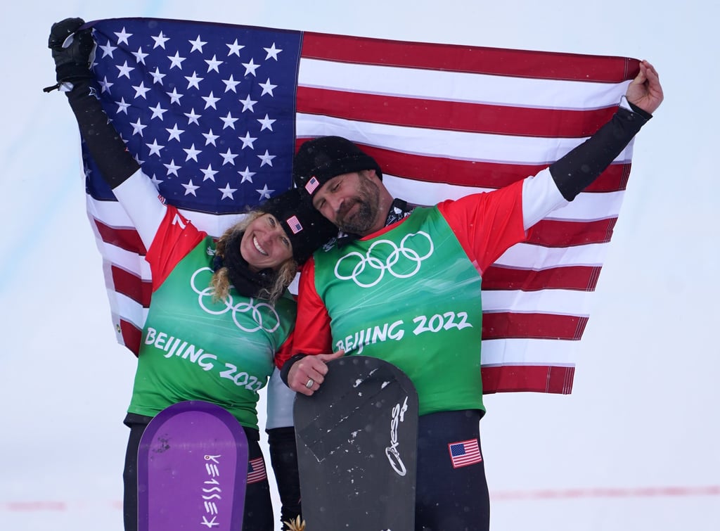 USA’s Lindsey Jacobellis (left) and Nick Baumgartner celebrate gold medal after the mixed team snowboarding cross final. Photo: dpa
