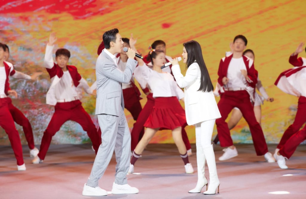 Tia Ray and William Chan Wai-Ting performing the Winter Olympics theme song ‘Together for a Shared Future’ at the 100-day countdown event. (Source: Handout)