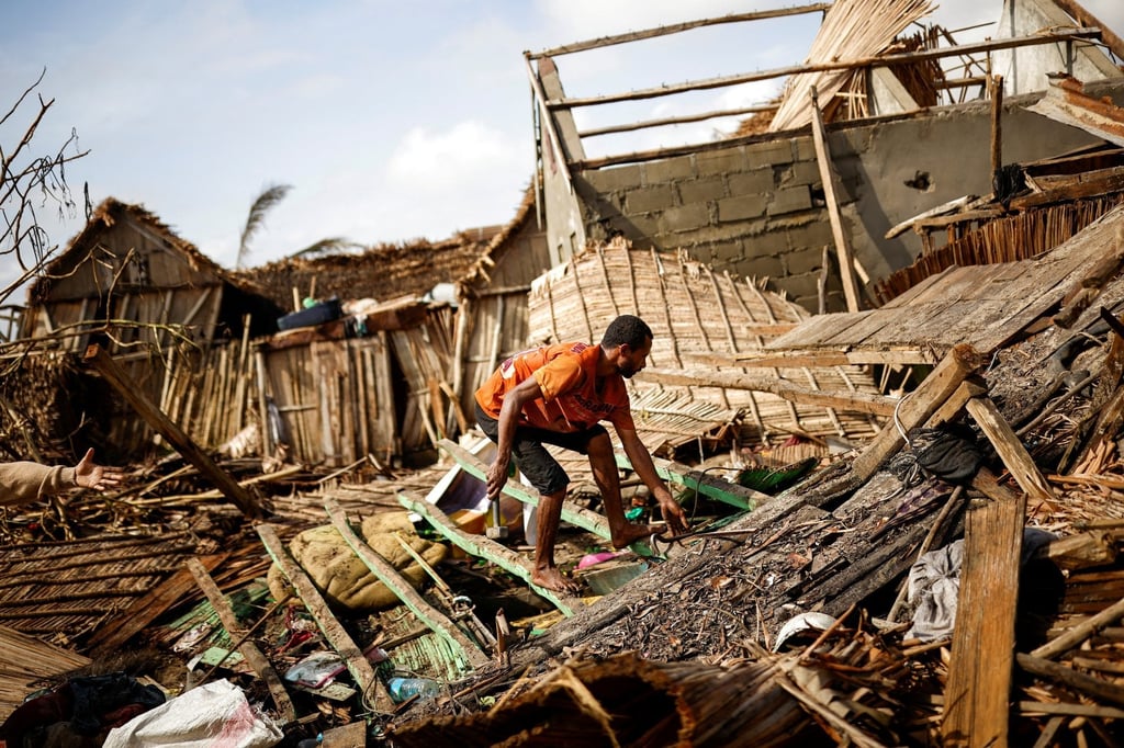 A man works on a destroyed house in the aftermath of Cyclone Batsirai in the town of Mananjary, Madagascar on February 8. Photo: Reuters