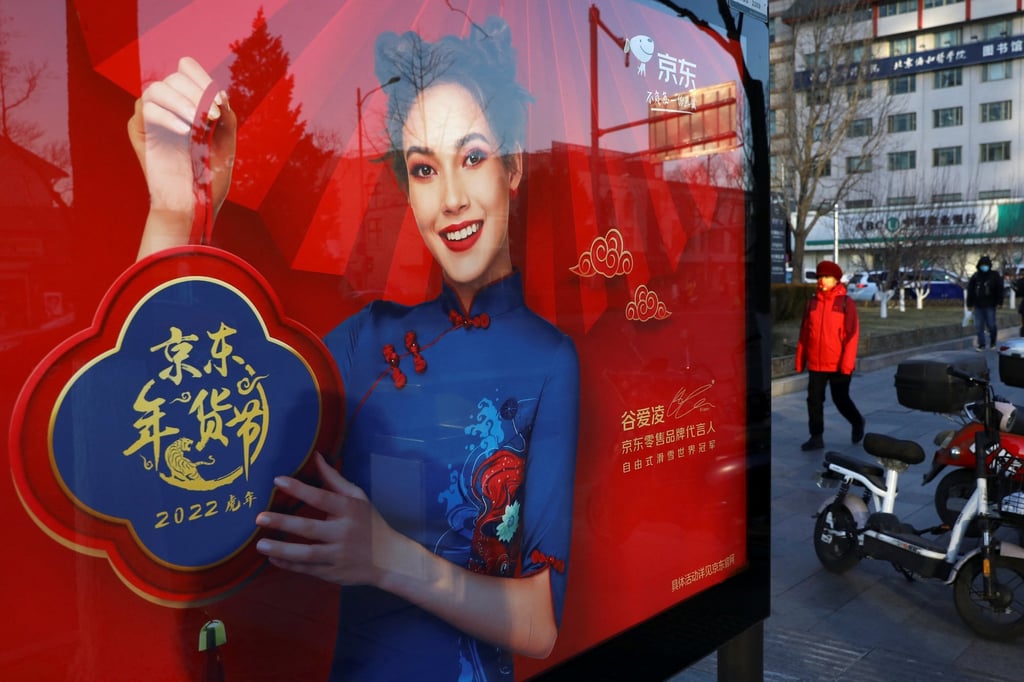 A JD.com advertisement with an image of freestyle skier Eileen Gu is seen at a bus stop in Beijing earlier this year. Photo: Reuters A JD.com advertisement with an image of freestyle skier Eileen Gu is seen at a bus stop in Beijing earlier this year. Photo: Reuters