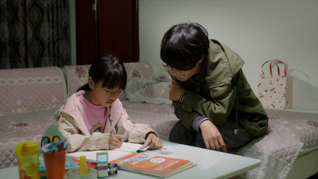 Liang Yonger with her mother, Liang Manchan, who had left their village to find work in the city but decided to return so they could be together every day. Liang Yonger with her mother, Liang Manchan, who had left their village to find work in the city but decided to return so they could be together every day.