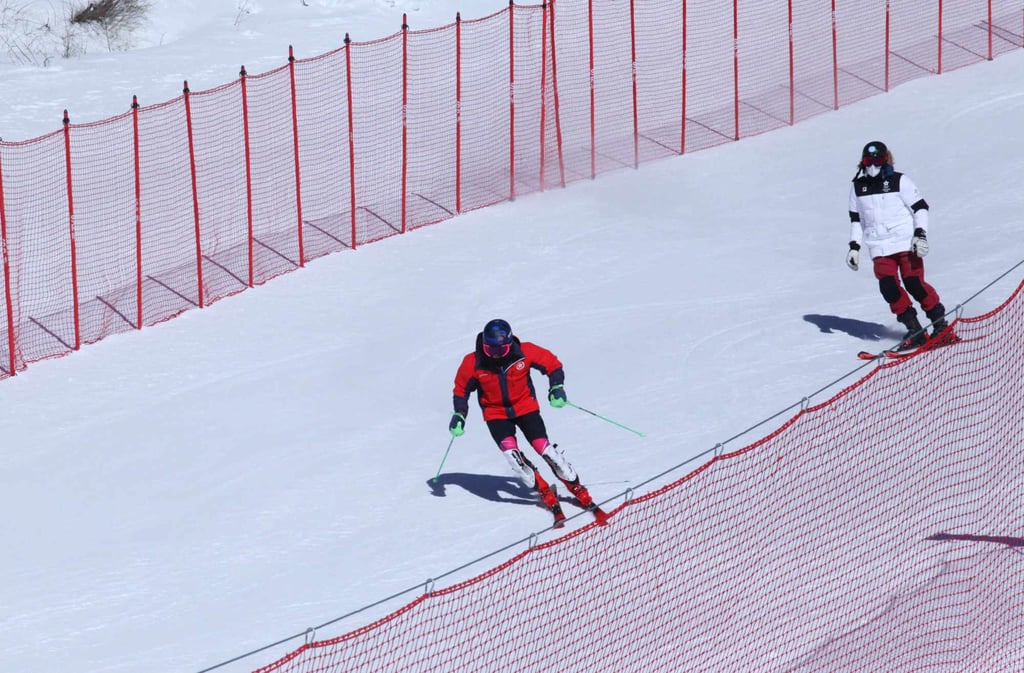 Hong Kong Alpine skier Adrian Yung Hau-tsuen training with head coach Marko Rudic of Bosnia at the Yanqing National Alpine Skiing Centre. Photo: HKSF&OC