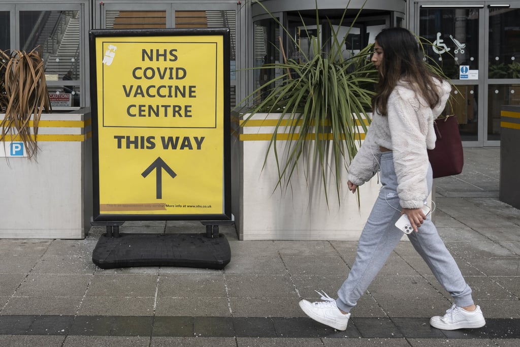 A woman walks past a Covid-19 vaccination centre in Brent, northwest London, Britain, on January 28. Globally, about 240 million doses purchased by wealthy countries are expected to go unused and expire by next month. Photo: Xinhua A woman walks past a Covid-19 vaccination centre in Brent, northwest London, Britain, on January 28. Globally, about 240 million doses purchased by wealthy countries are expected to go unused and expire by next month. Photo: Xinhua