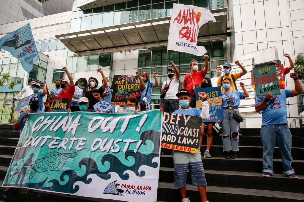 Activists and fisherman during a protest at the Chinese consulate in Manila, Philippines, in November. They protested after Chinese ships fired water cannons at Philippine supply boats transporting food to military personnel. Photo: EPA-EFE Activists and fisherman during a protest at the Chinese consulate in Manila, Philippines, in November. They protested after Chinese ships fired water cannons at Philippine supply boats transporting food to military personnel. Photo: EPA-EFE