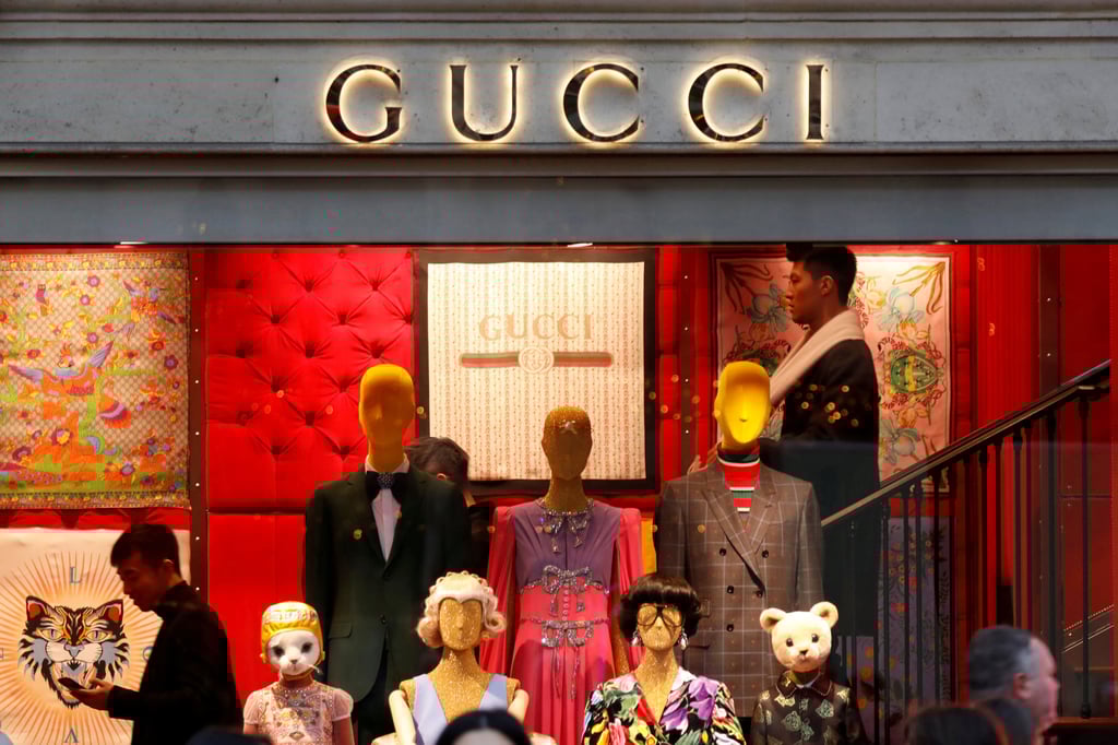 A Gucci sign is seen outside a shop in Paris, France, in December 2017. Photo: Reuters